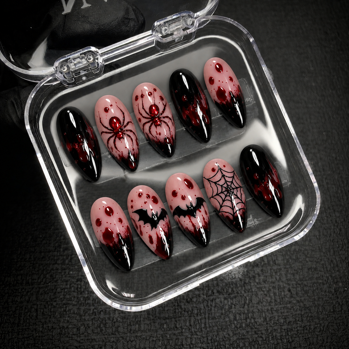 Open Nail Handy package displaying the Crimson Web press-on nail set and included contents.