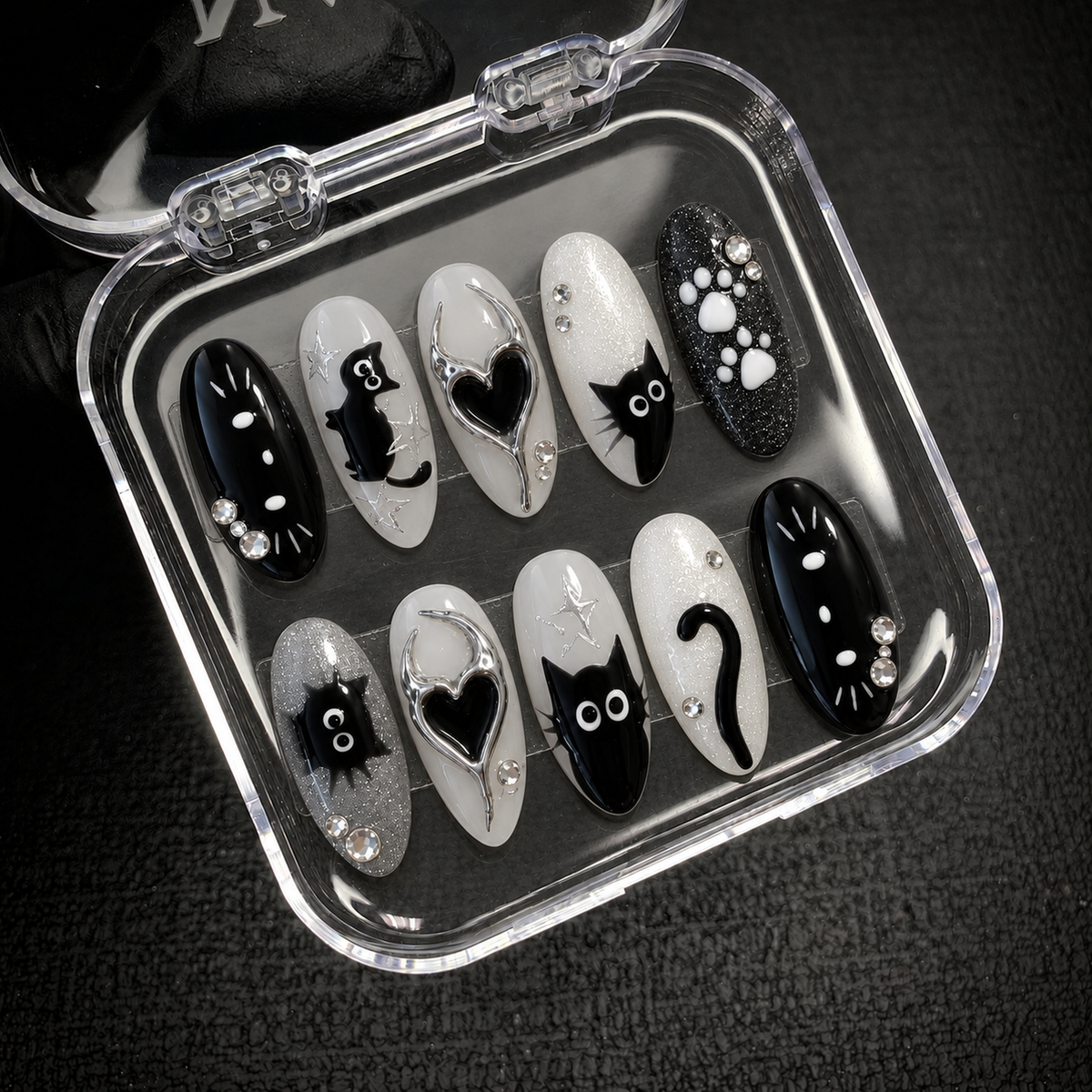 Open Nail Handy package presentation for the Chrome Void Cats press-on nail set and included materials.