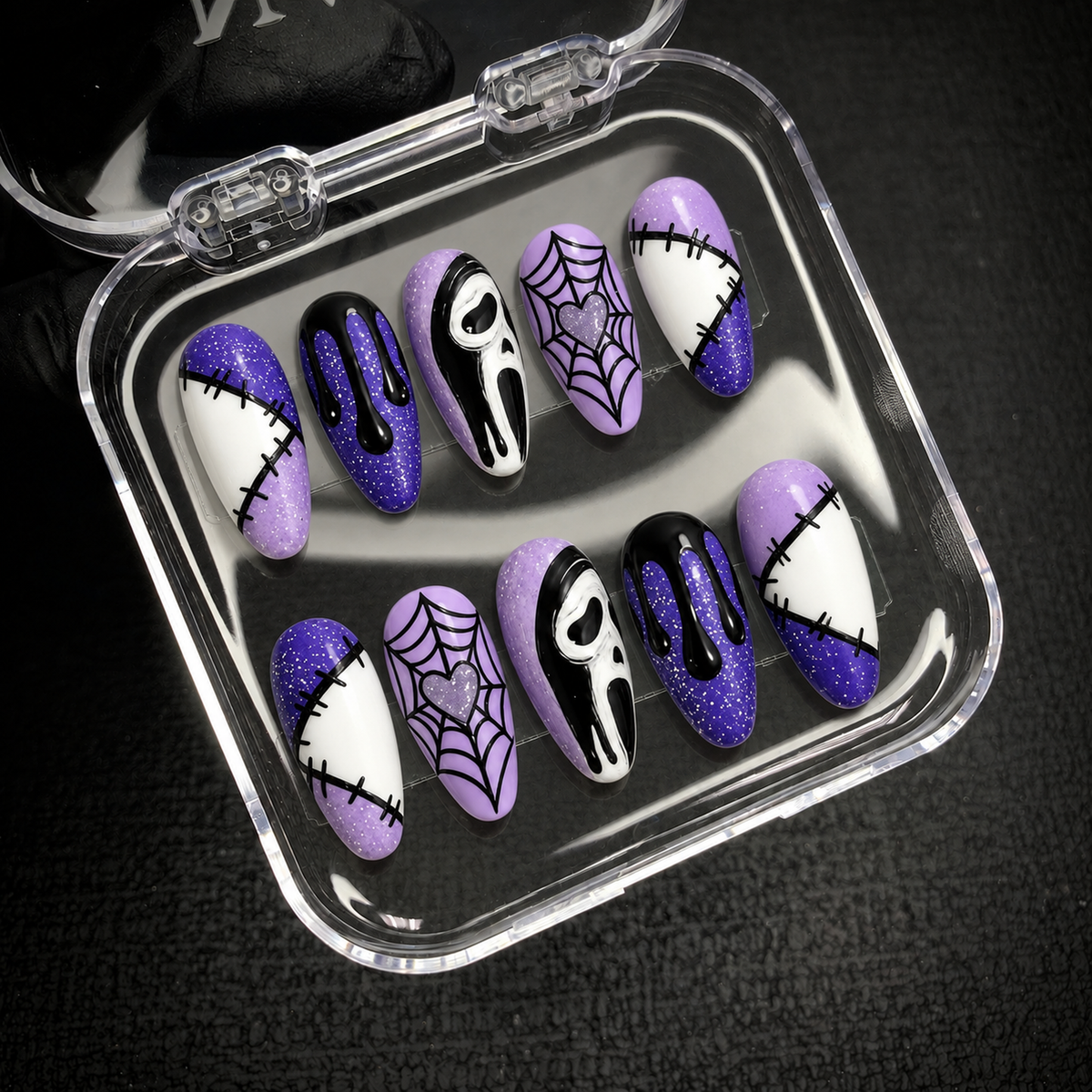Open Nail Handy package box displaying the Violet Stitch Web press-on nail set and included materials.