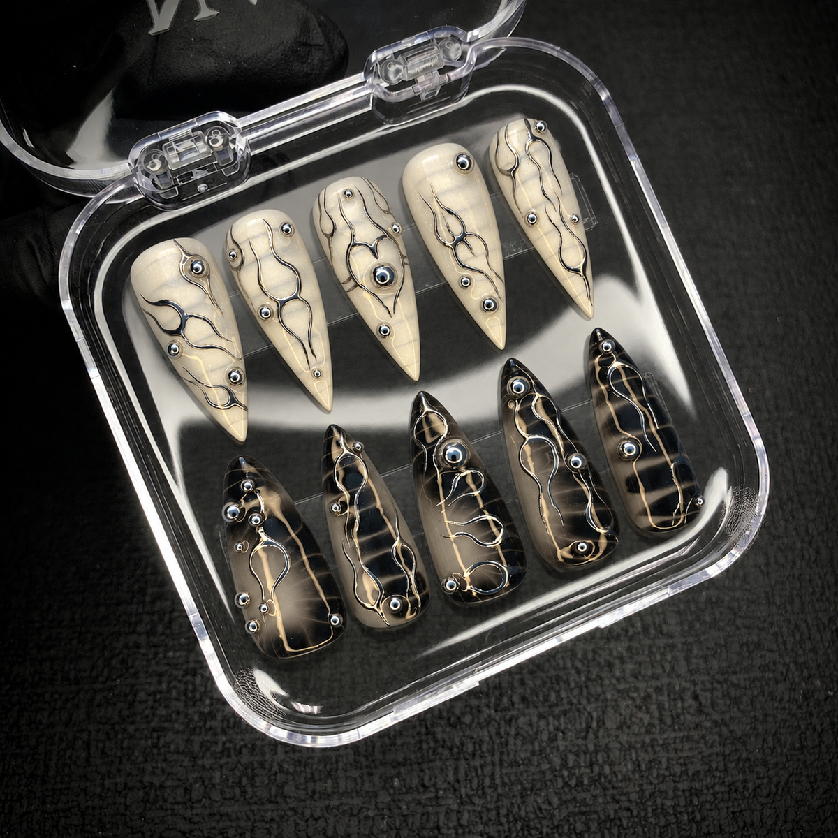 Chrome Circuit press-on nails displayed inside an open Nail Handy package box.