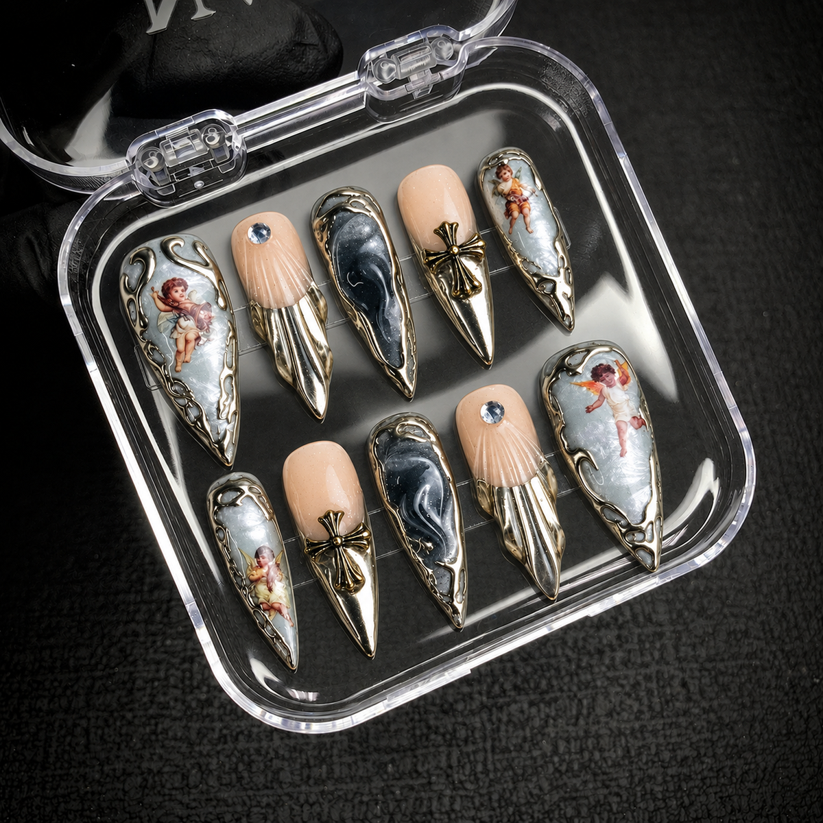 Open Nail Handy package displaying the Fallen Angel press-on nail set.