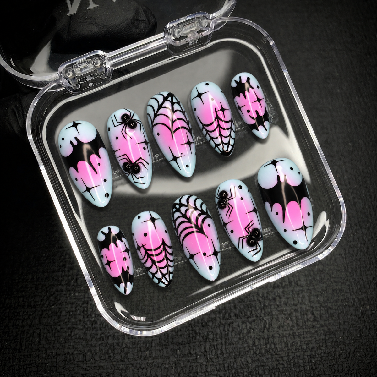 Open Nail Handy package box with the Neon Web Drip press-on nail set inside