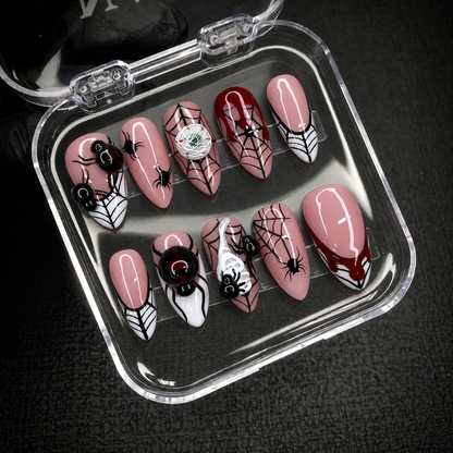 Open Nail Handy package box with Crimson Web Crawl press-on nail set and included contents.