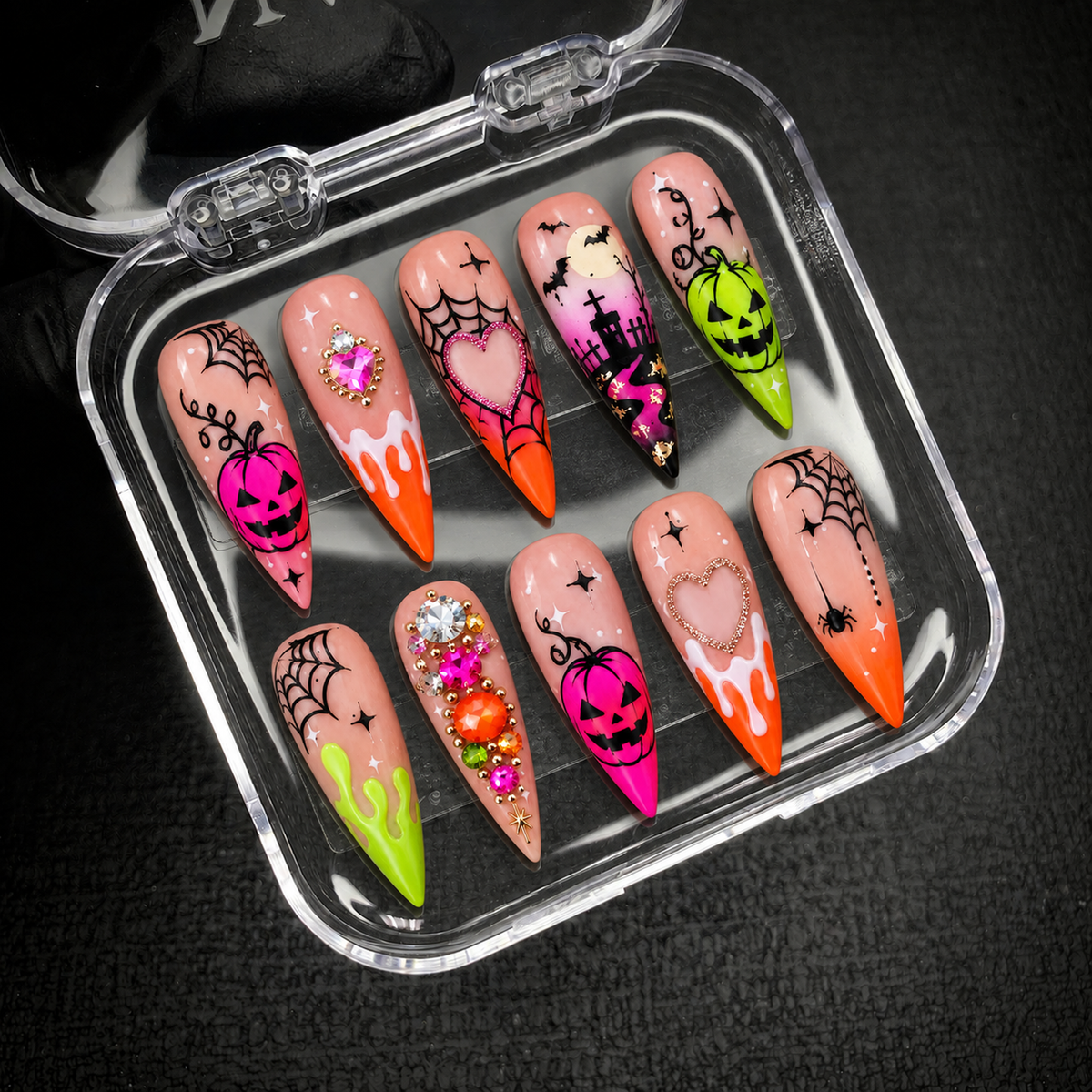 Open Nail Handy branded package displaying the Neon Pumpkin Web press-on nail set.