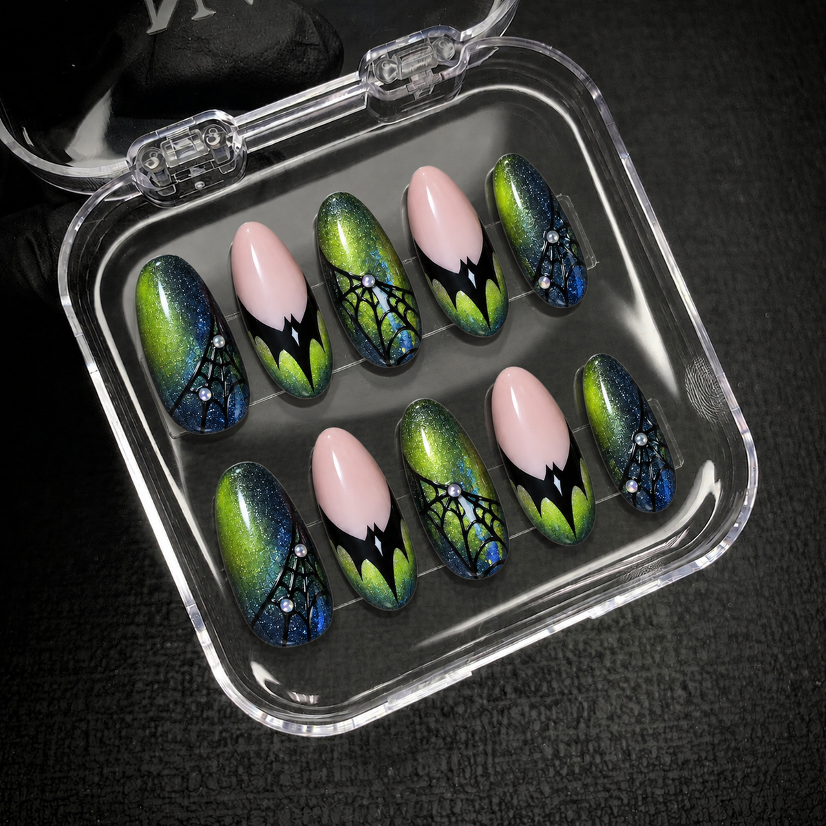 Open Nail Handy package displaying the Venom Web press-on nail set and included contents