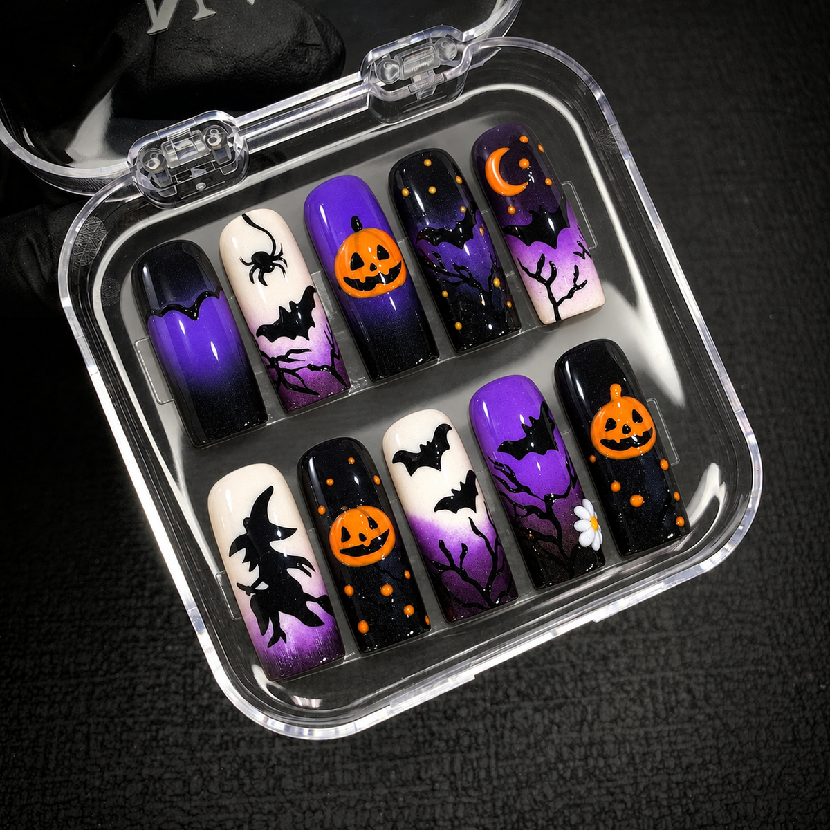 Open Nail Handy package showing the Midnight Pumpkin Spell press-on nail set and included presentation packaging.