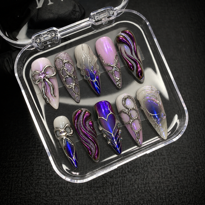 Open Nail Handy package presentation for the Chrome Bow Reverie press-on nail set.