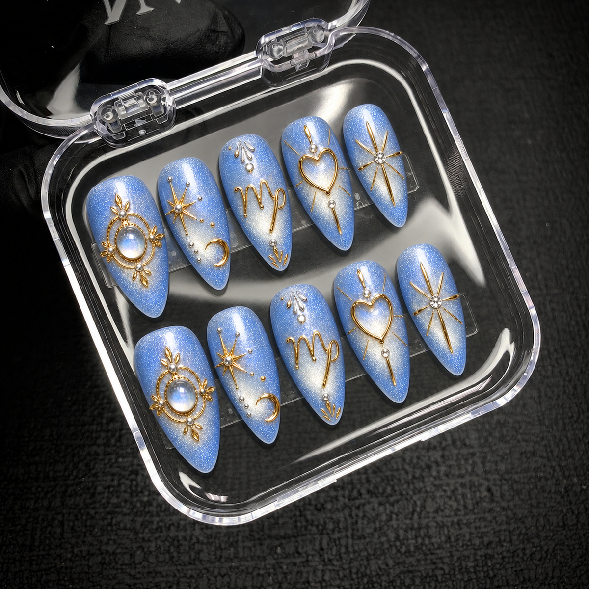 Open Nail Handy brand package containing the Celestial Blue Reverie light-blue and gold press-on nail set.
