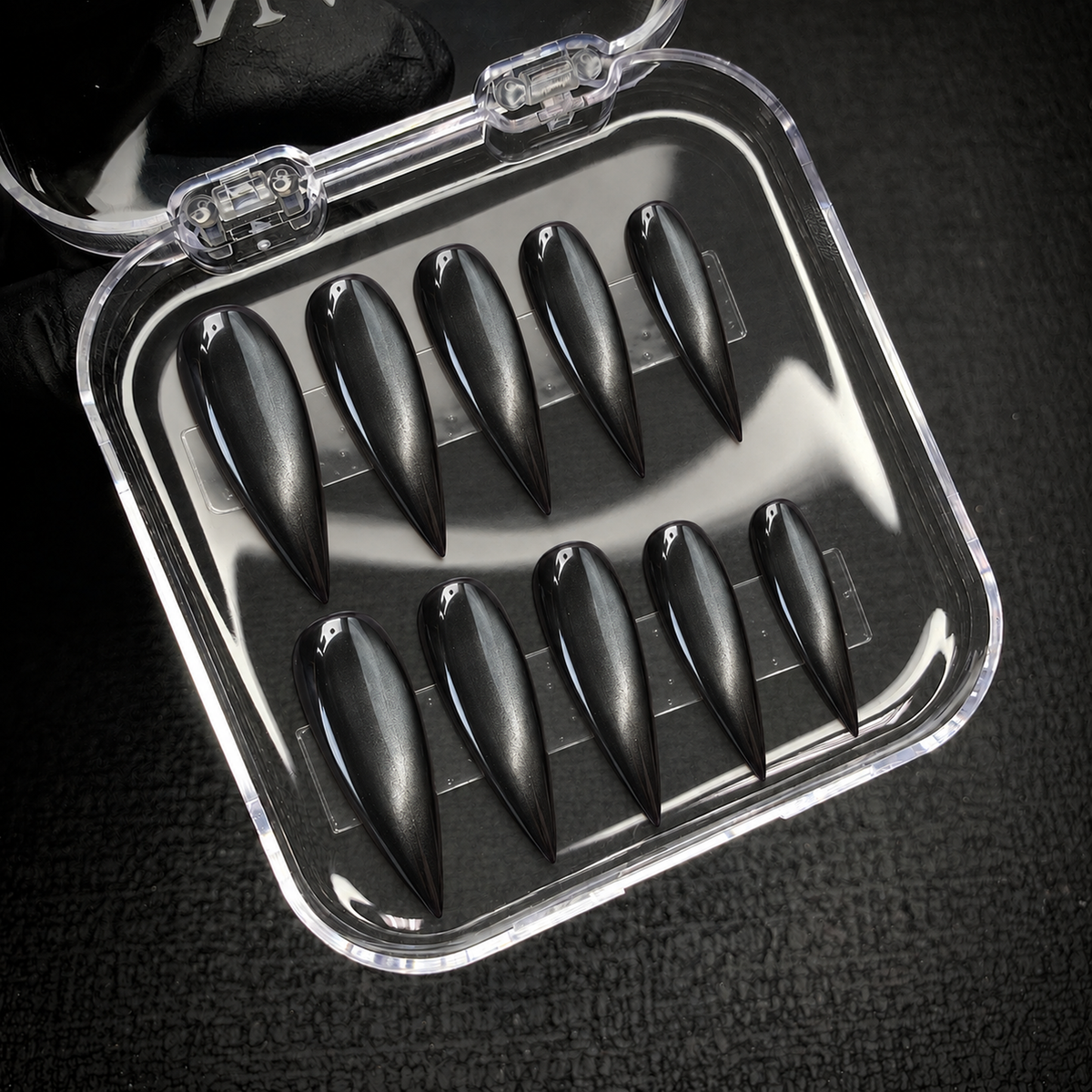 Open Nail Handy package displaying the Obsidian Pearl press-on nail set.