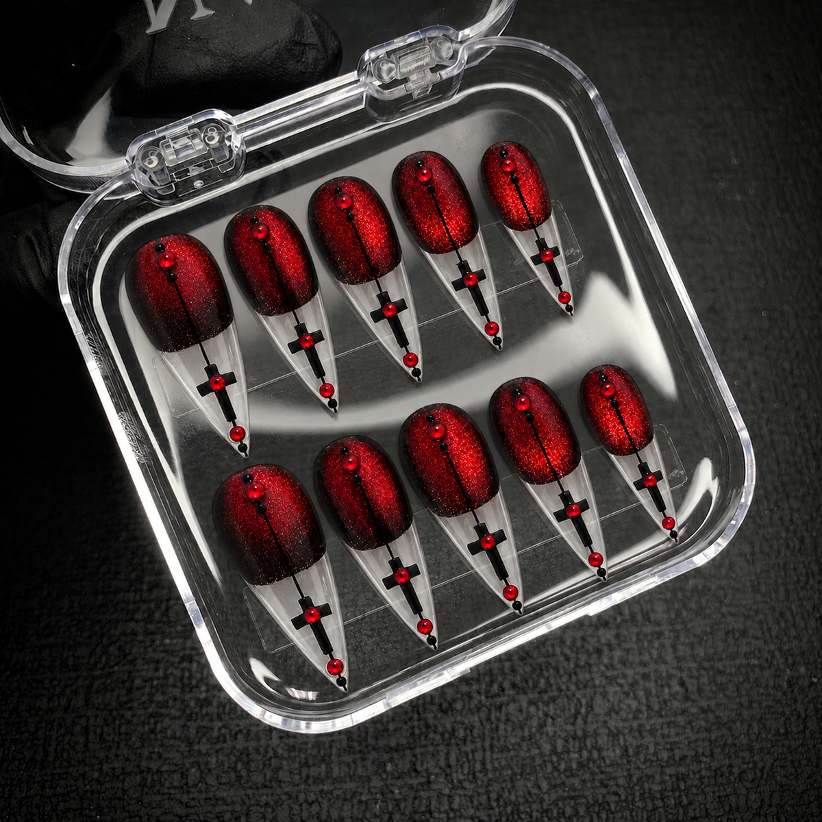Open Nail Handy package displaying the Crimson Cross Velvet press-on nail set.