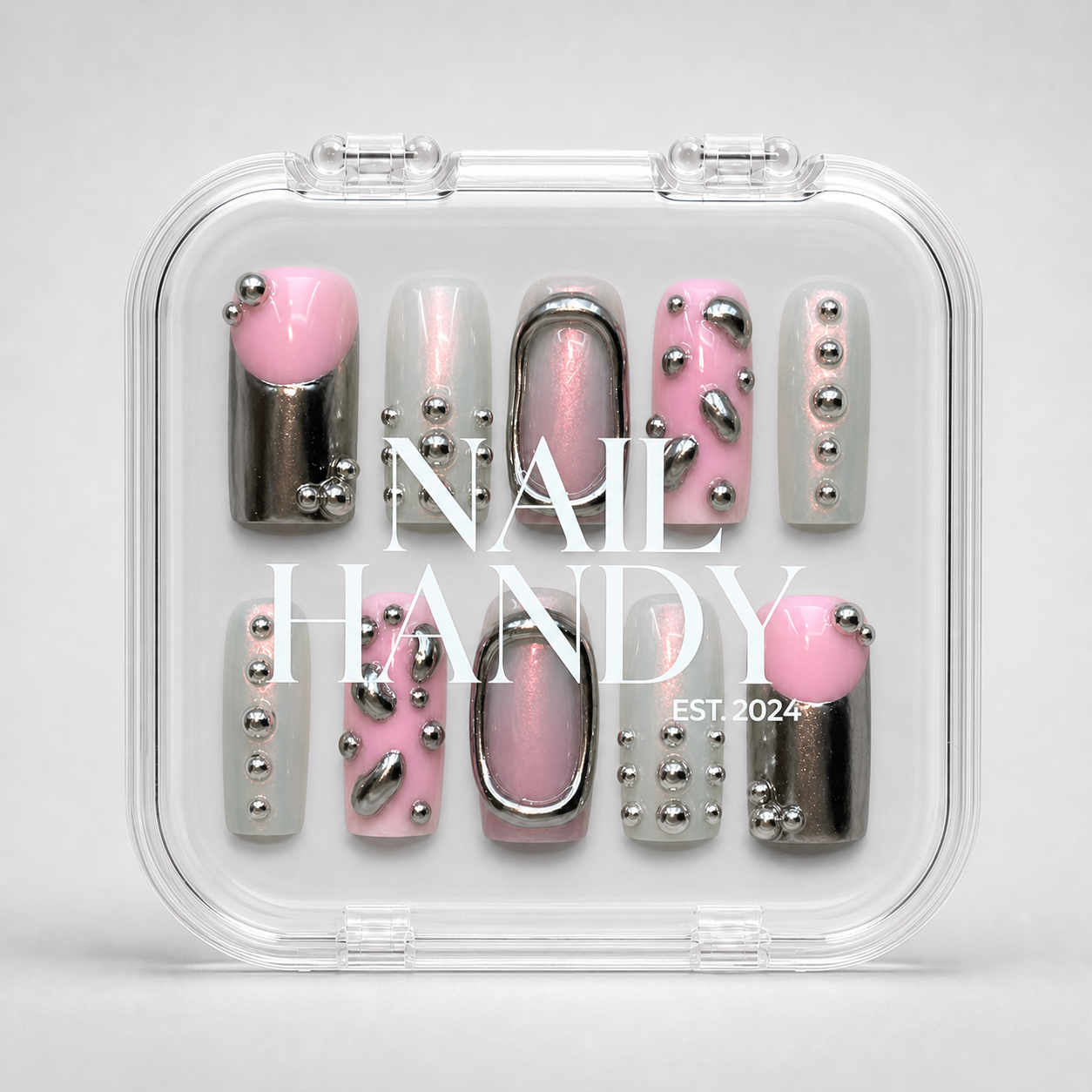 Chrome Petal press-on nails shown with the included Nail Handy brand package box.