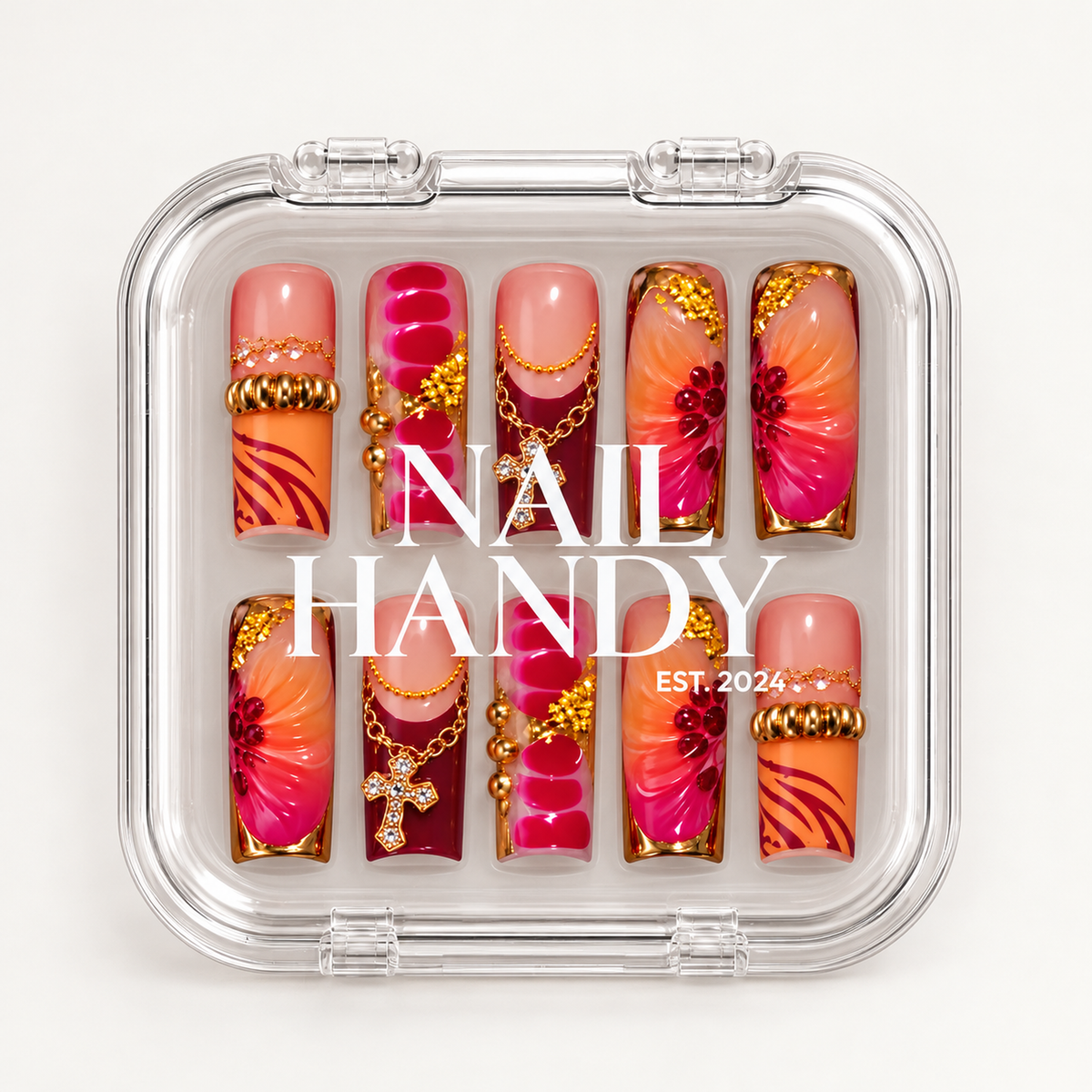 Closed clear Nail Handy case displaying ten coordinated floral and charm-accented nails beneath white lid lettering.
