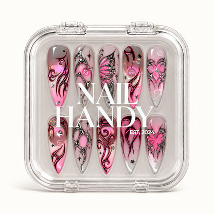 Closed clear Nail Handy case displaying ten coordinated nails with pink butterfly motifs, silver outlines, magenta curves, and small stars.