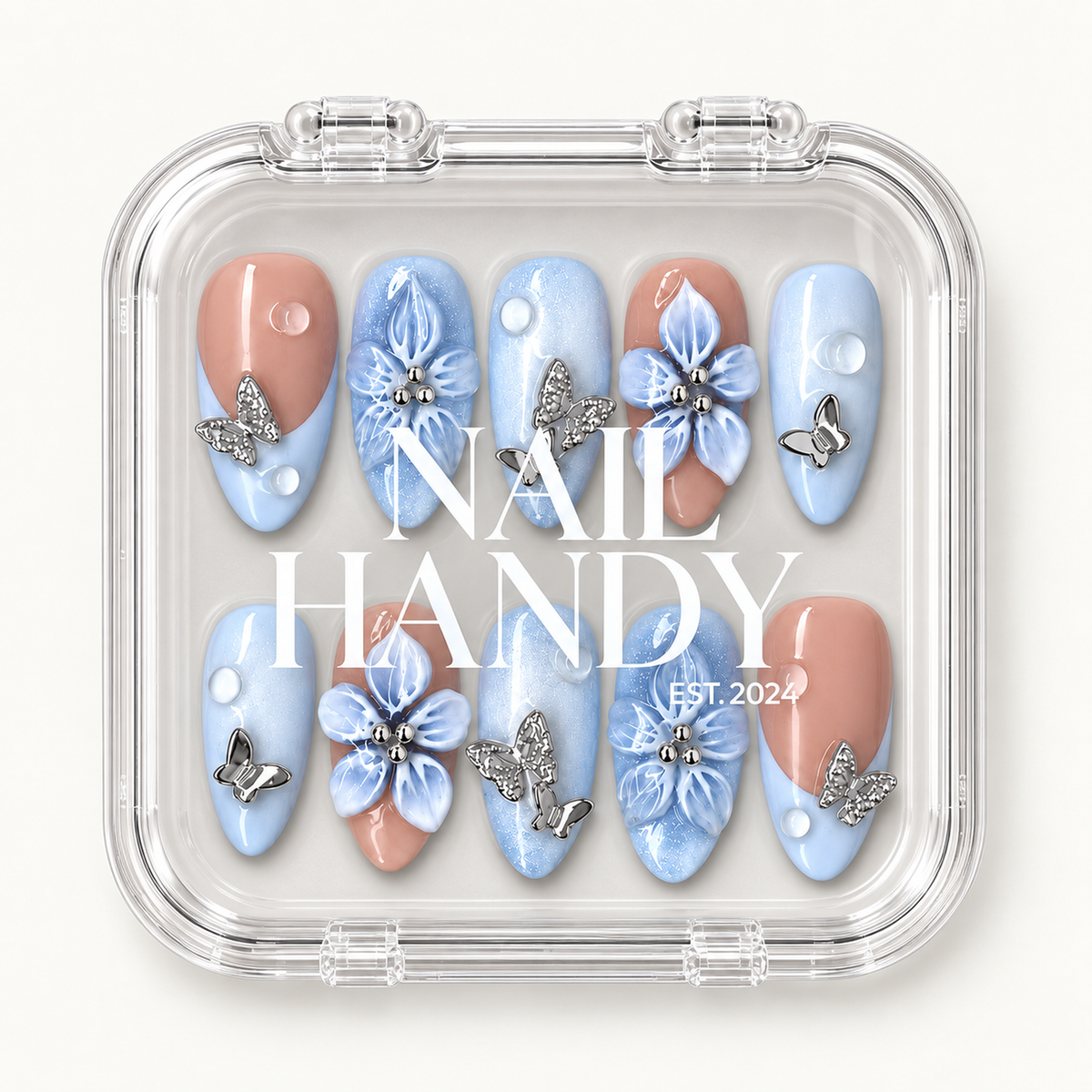 Clear Nail Handy case displaying the coordinated blue and peach floral nail set beneath white brand lettering.