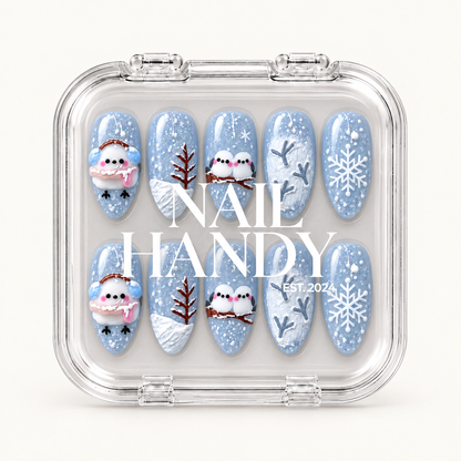 Clear presentation case displaying ten blue winter nails beneath Nail Handy lettering.