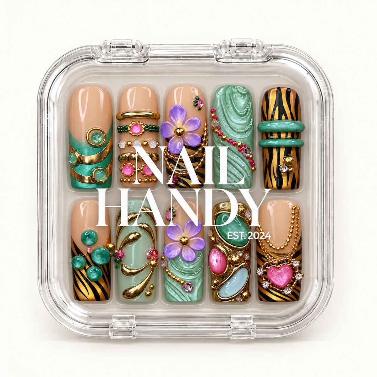 Closed clear Nail Handy case displaying ten coordinated floral and jewelry-inspired nails beneath white branding on the lid.