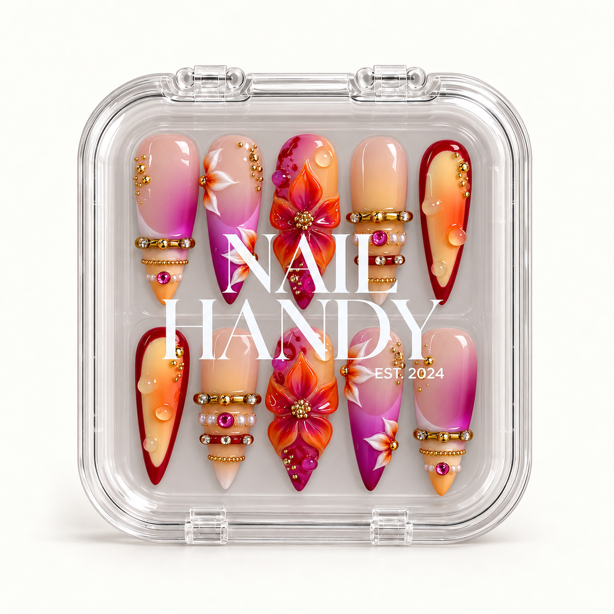 Closed clear case with white Nail Handy lettering, displaying ten pink, orange, and burgundy nails with raised flowers and gold-tone details.