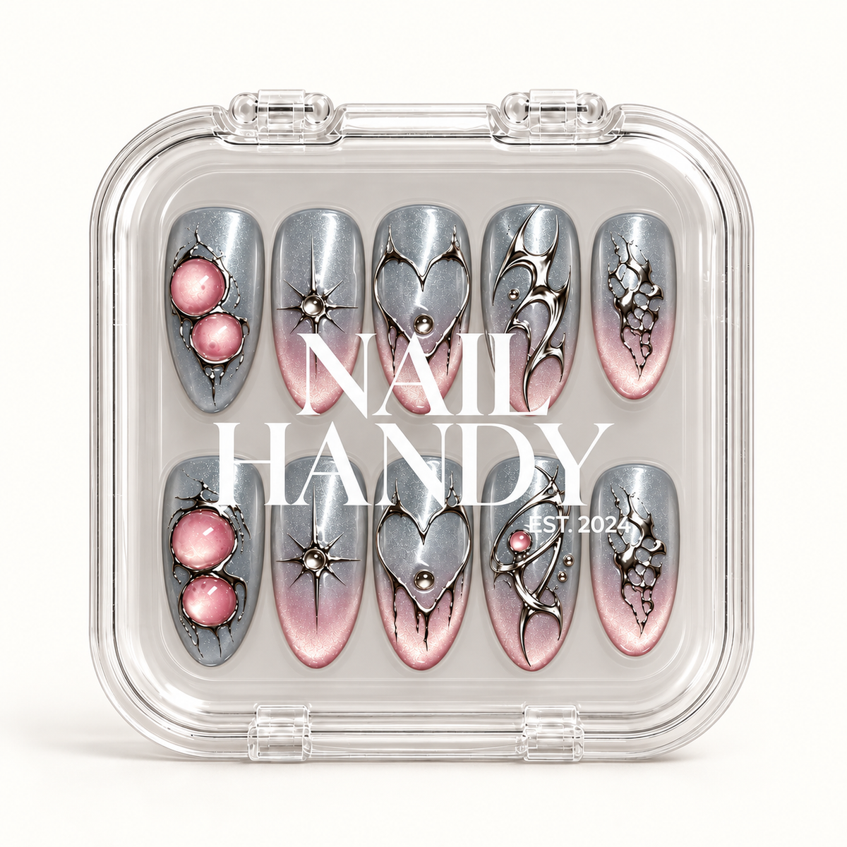 Closed clear Nail Handy case displaying ten silver-gray and blush pink nails in two rows beneath white branding.