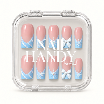 Clear Nail Handy case displaying ten pink and icy blue press-on nails beneath the branded lid.