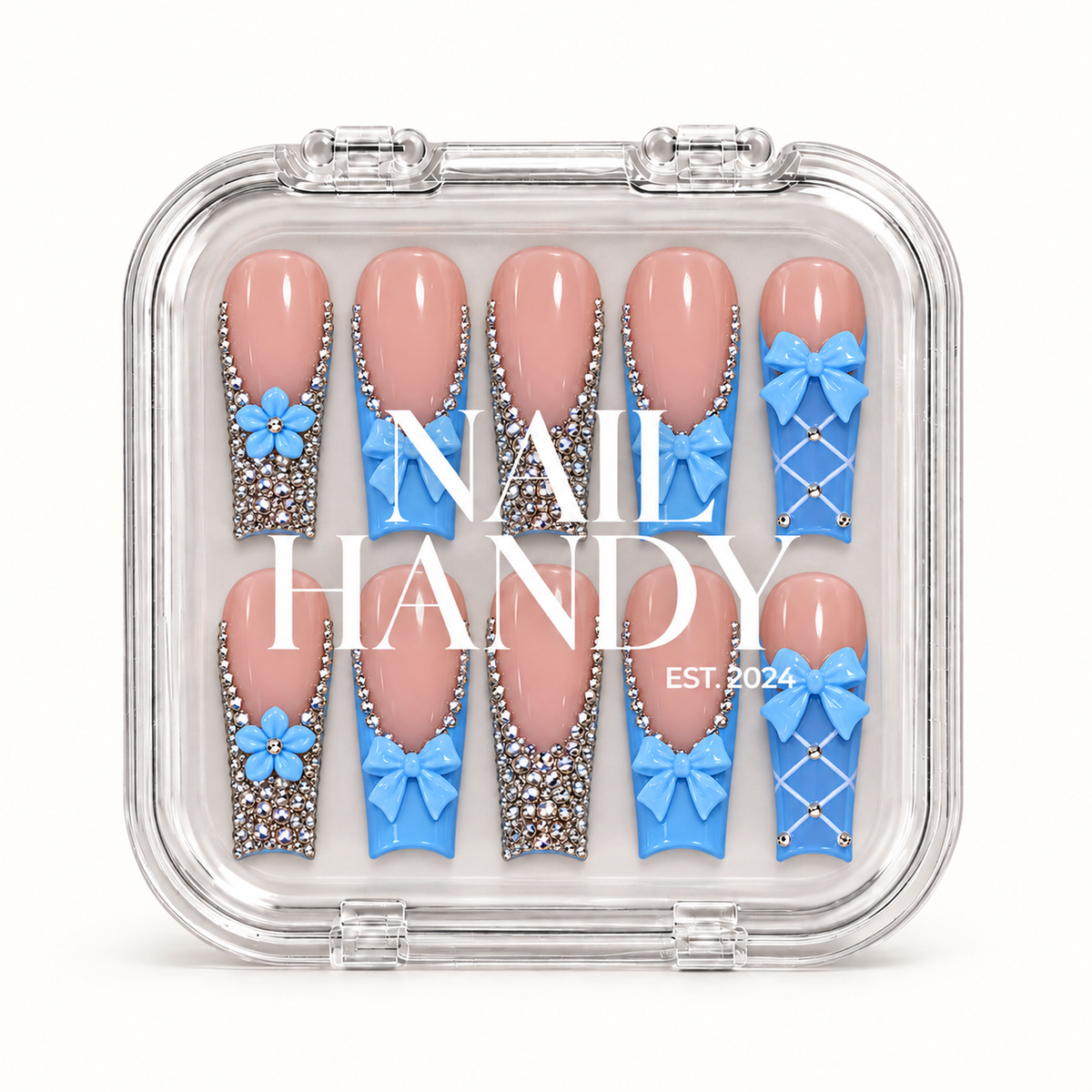 Closed clear Nail Handy case displaying ten pink and blue nails with bow, flower, lattice, and rhinestone accents beneath white branding.