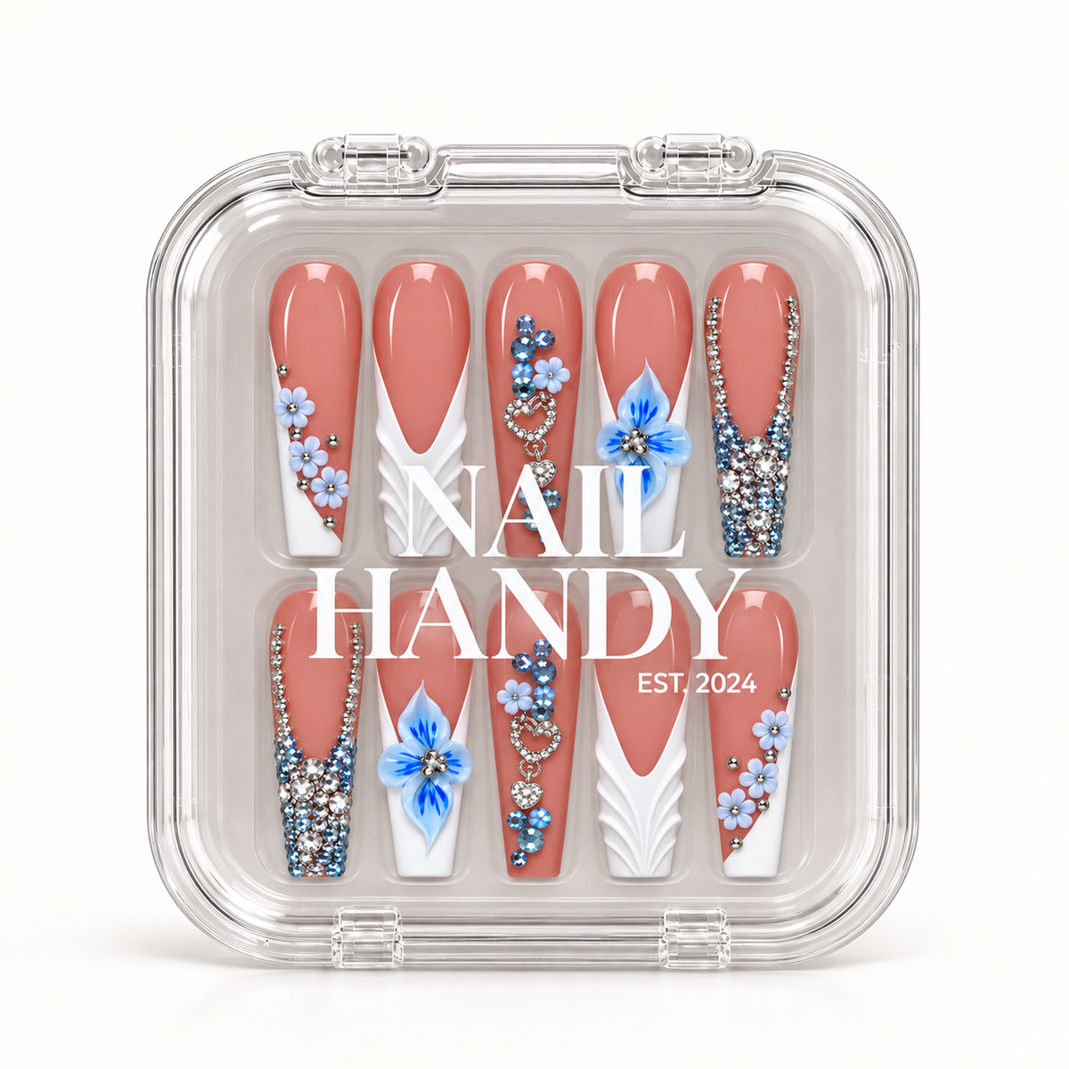 Closed clear Nail Handy case displaying ten coral-pink nails with blue flowers, white sculpted accents, heart ornaments, and clear and blue rhinestone details.
