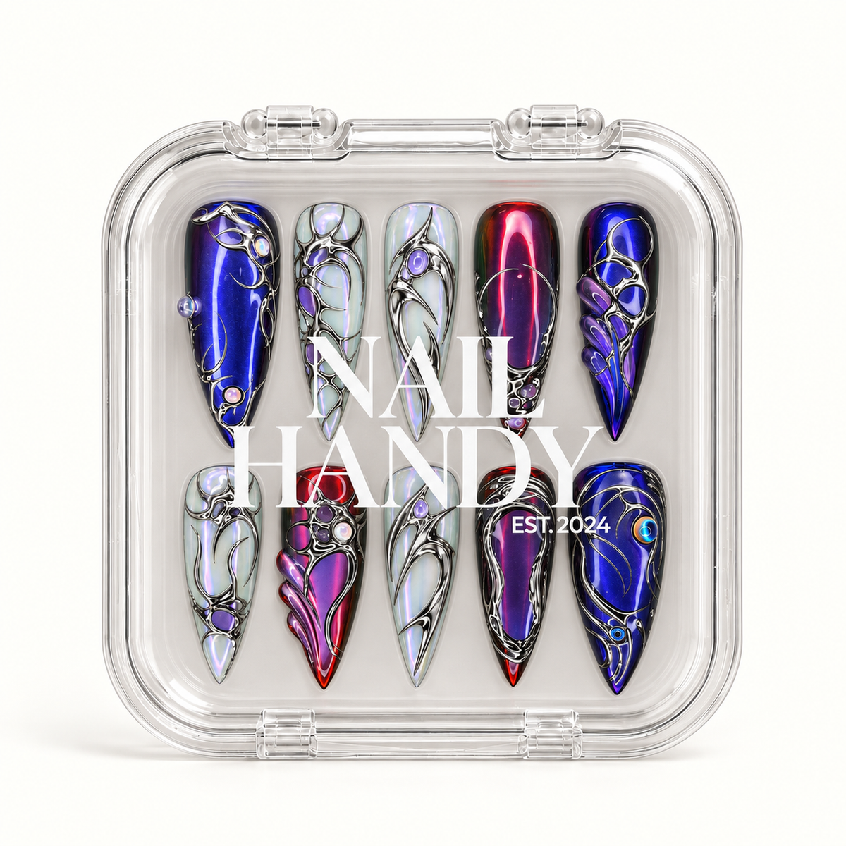 Closed clear Nail Handy case displaying ten pointed nails in two rows, with blue, wine-purple, and pearly iridescent designs visible beneath white branding.