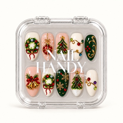 Closed clear Nail Handy case displaying ten Christmas press-on nails with wreaths, trees, bells, ornament details, and snowflakes.