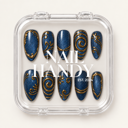 Clear Nail Handy case displaying two rows of deep blue shimmer nails with gold scroll and border designs.