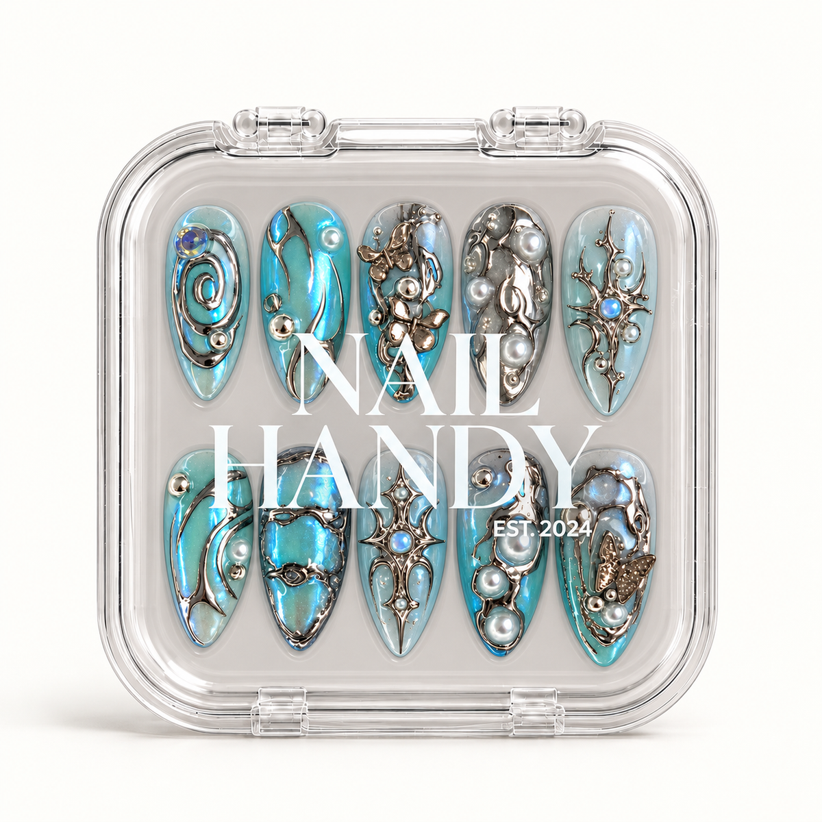 Clear closed case displaying ten blue and silver-tone decorated nails beneath white Nail Handy branding on a light background.