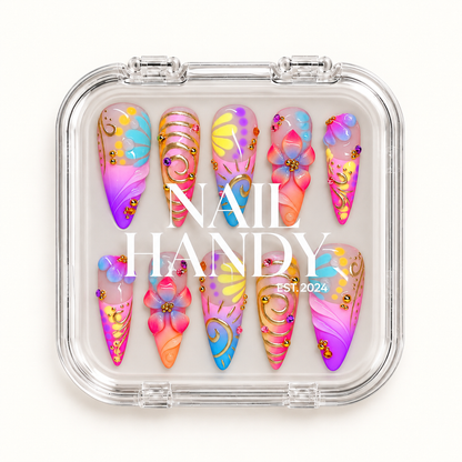Closed clear Nail Handy case displaying ten colorful floral and swirl nails beneath white branding on the lid.