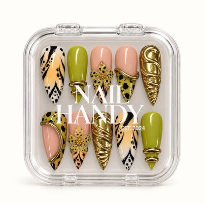 Closed clear Nail Handy case displaying ten coordinated chartreuse, nude pink, black-patterned, floral, and gold-tone accent nails.