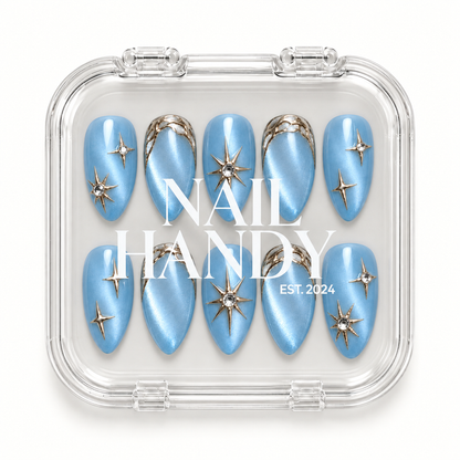 Ten pearly blue nails visible through a clear case with Nail Handy lettering across the front.