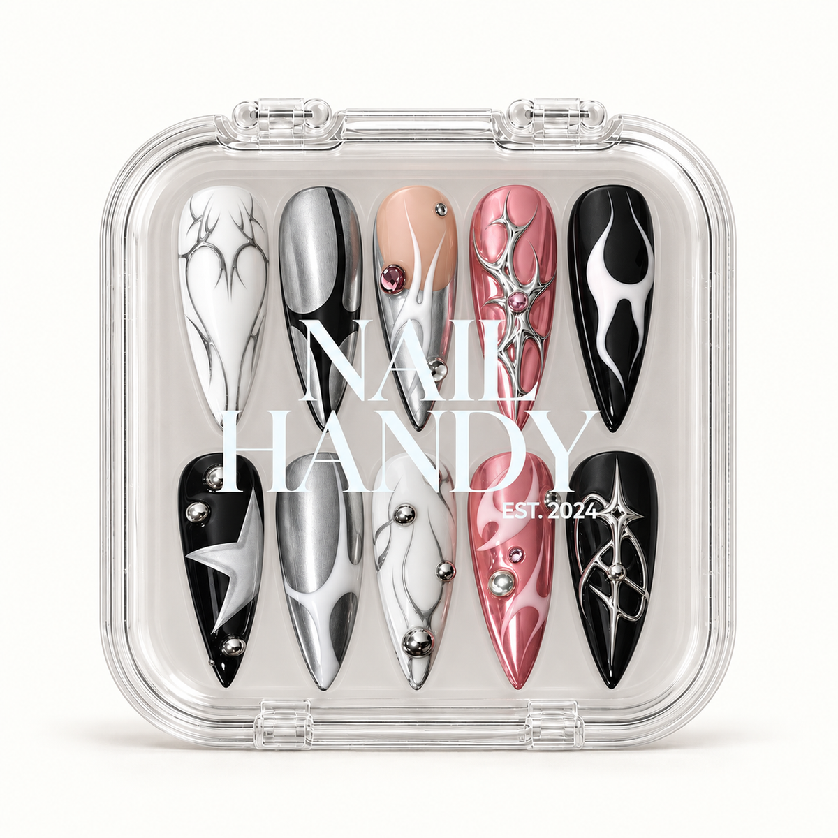 Closed clear Nail Handy case displaying ten coordinated nails in two rows, featuring pink, silver, black, white, and nude designs beneath white lid lettering.