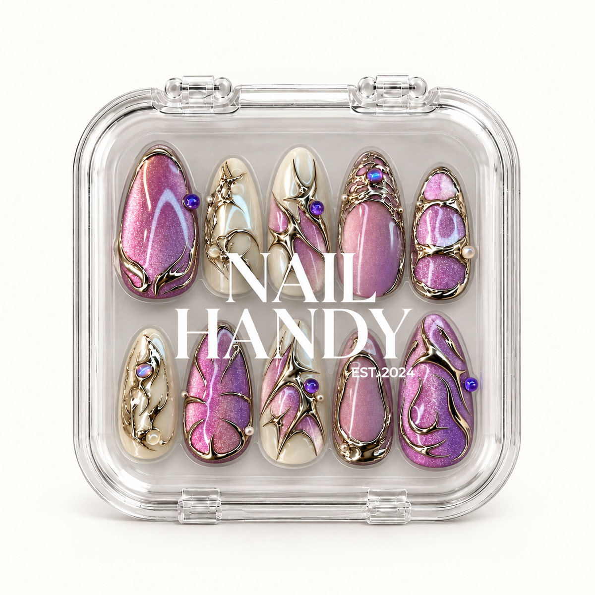 Closed clear Nail Handy case displaying ten pink-lilac shimmer and ivory nails with metallic detailing beneath white lettering.