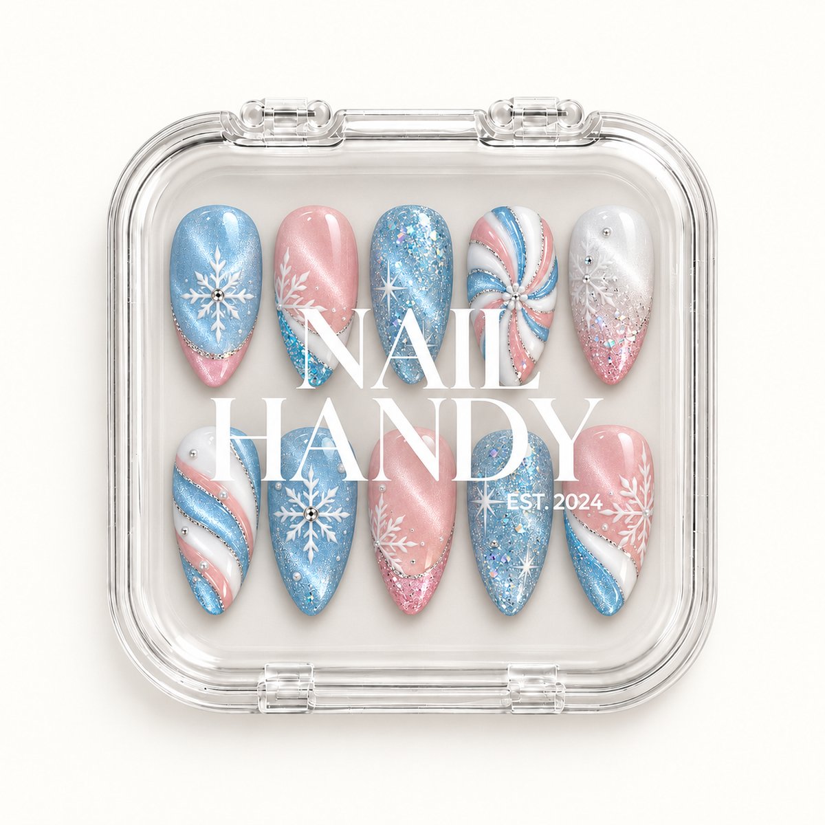 Closed clear Nail Handy case displaying ten coordinated pastel winter nails with blue glitter, pink shimmer, white snowflakes, and swirl accents.