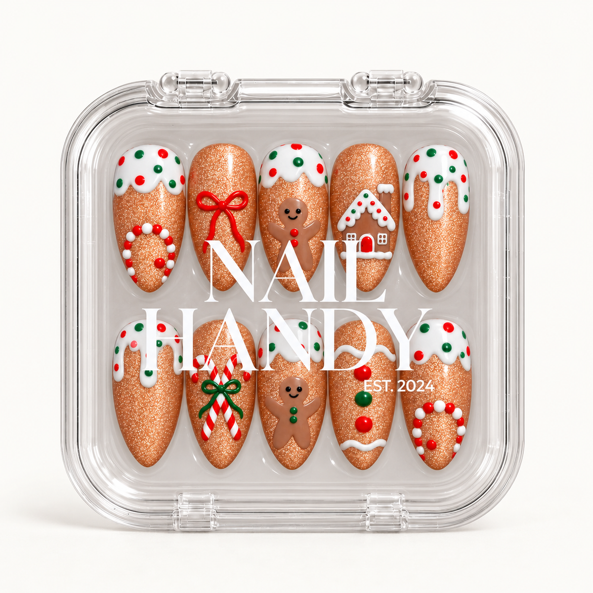 Closed clear Nail Handy case holding ten gingerbread-themed nails in two rows, with white branding across the lid.