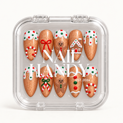 Closed clear Nail Handy case holding ten gingerbread-themed nails in two rows, with white branding across the lid.