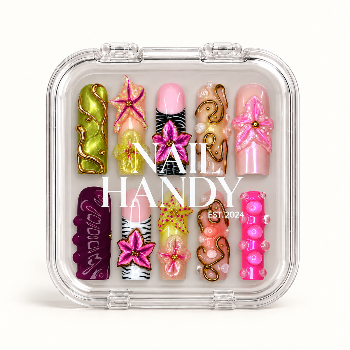 Closed clear case with white Nail Handy lettering displaying ten colorful nails with raised floral accents, zebra stripes, and gold-tone swirls.