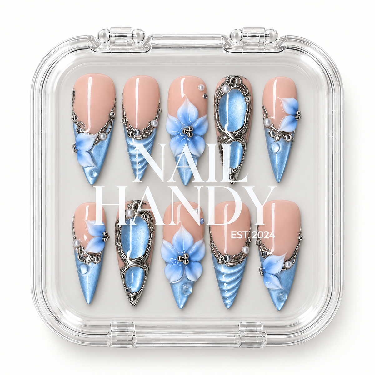 Clear Nail Handy case displaying ten coordinated pink-and-blue floral press-on nails in two rows.