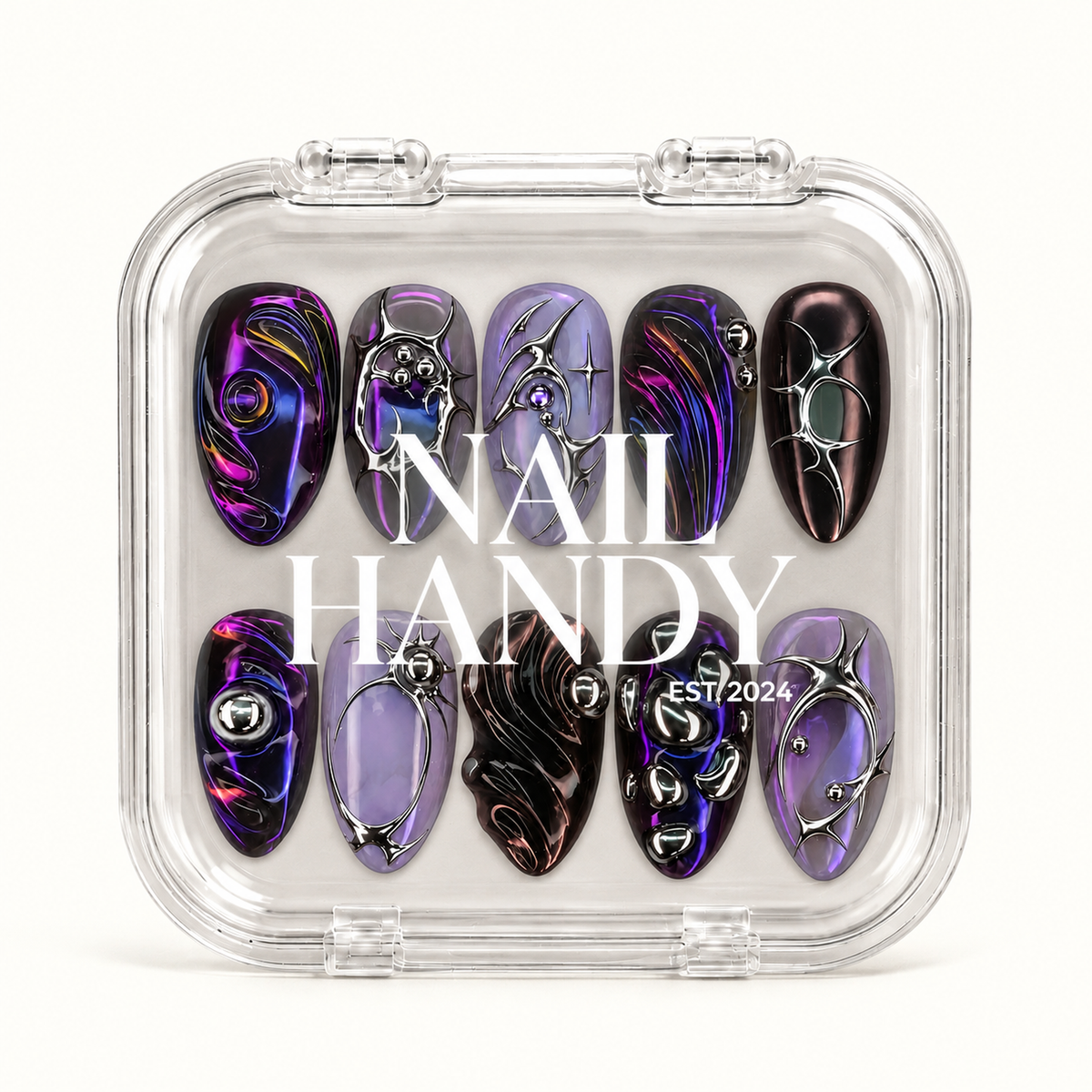 Closed clear Nail Handy case displaying ten violet, near-black, and lavender nails beneath white branding on the lid.