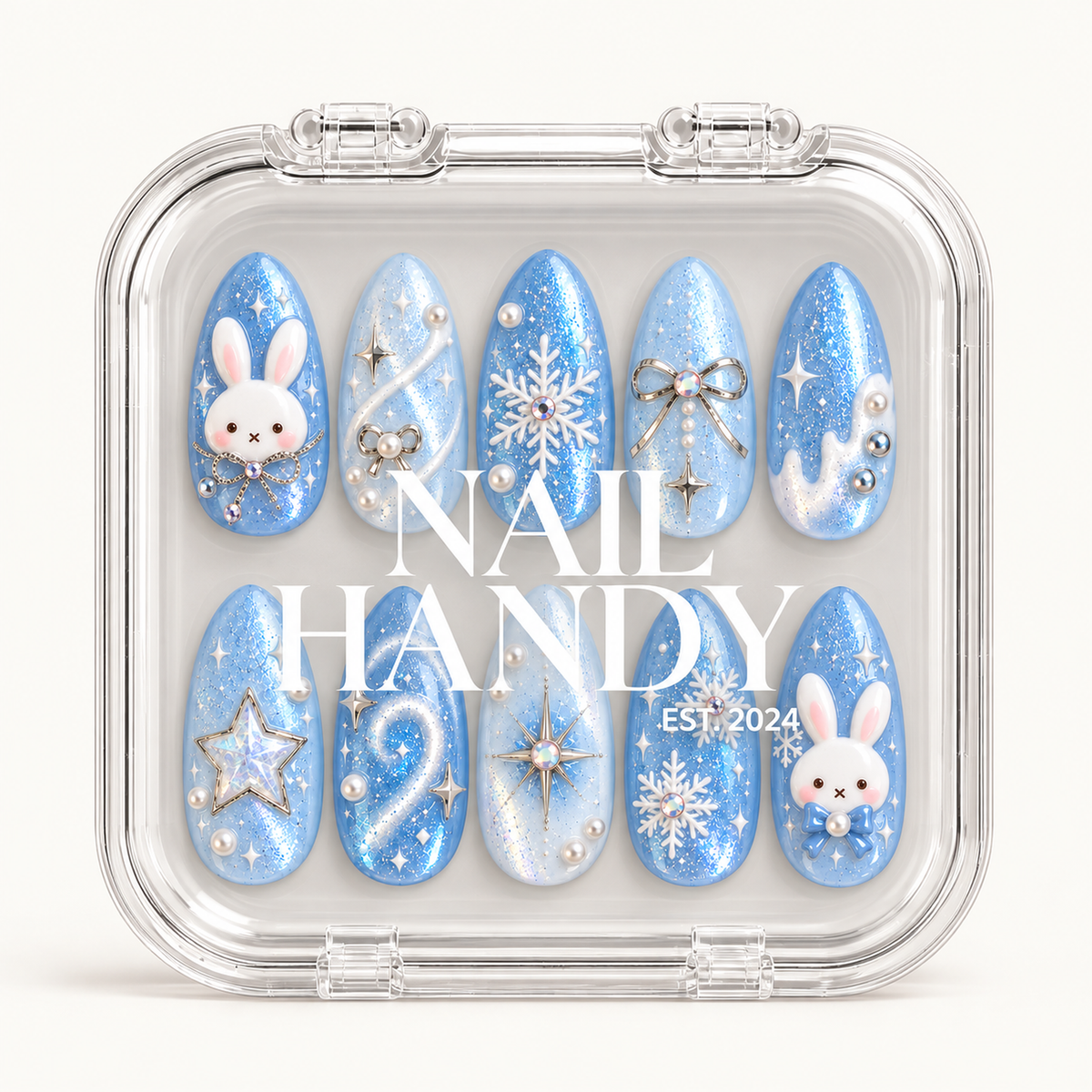 Closed clear case with white Nail Handy lettering, displaying ten coordinated blue winter nails in two rows on a light background.