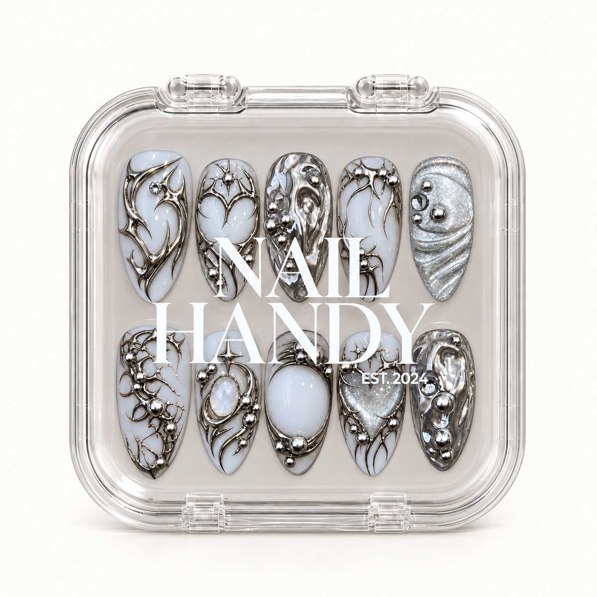 Closed clear Nail Handy case displaying ten white and silver nails in two rows beneath white lettering on the lid.