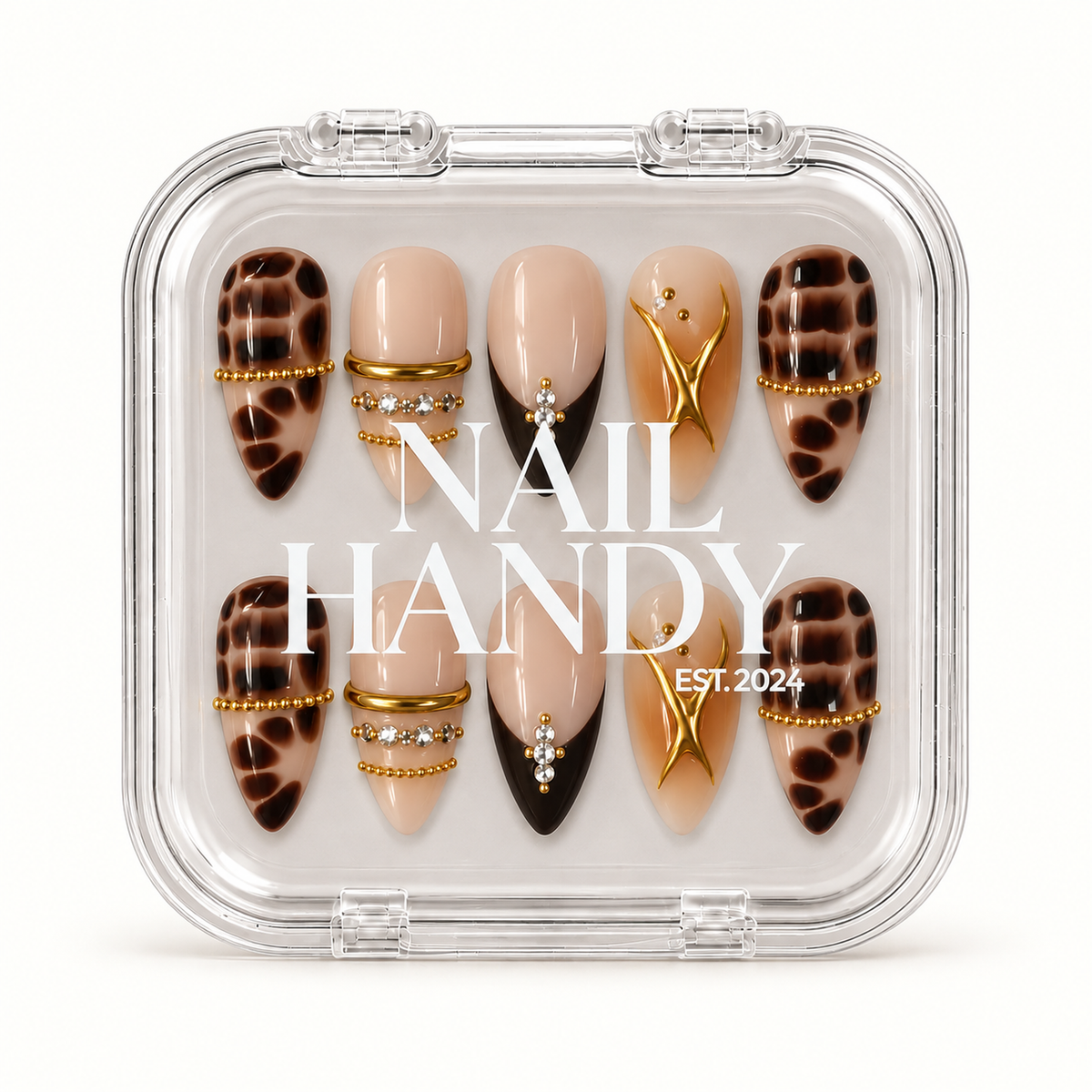 Closed clear Nail Handy case displaying ten nude and brown nails with tortoiseshell-style patterning, gold-colored embellishments, and clear stone accents.