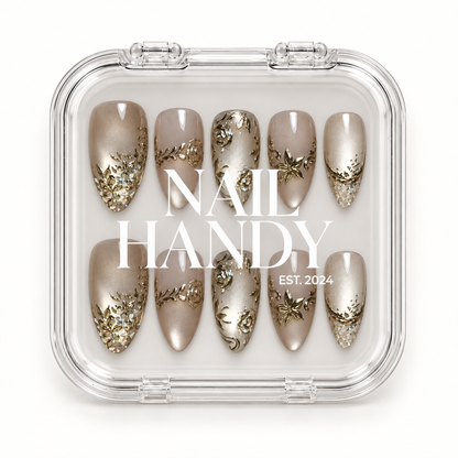 Closed clear Nail Handy case displaying ten champagne and greige nails in two rows, with white branding across the lid.