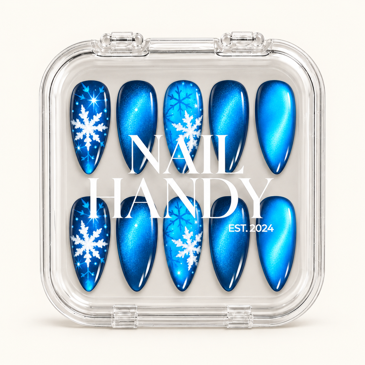 Clear case with white Nail Handy lettering displaying ten blue shimmer and snowflake nails in two rows against a light background.