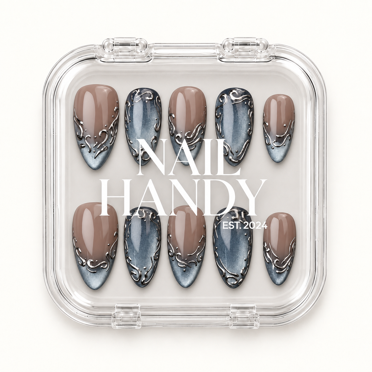 Clear Nail Handy case showing ten greige and blue-gray scrollwork nails beneath the printed brand lettering.