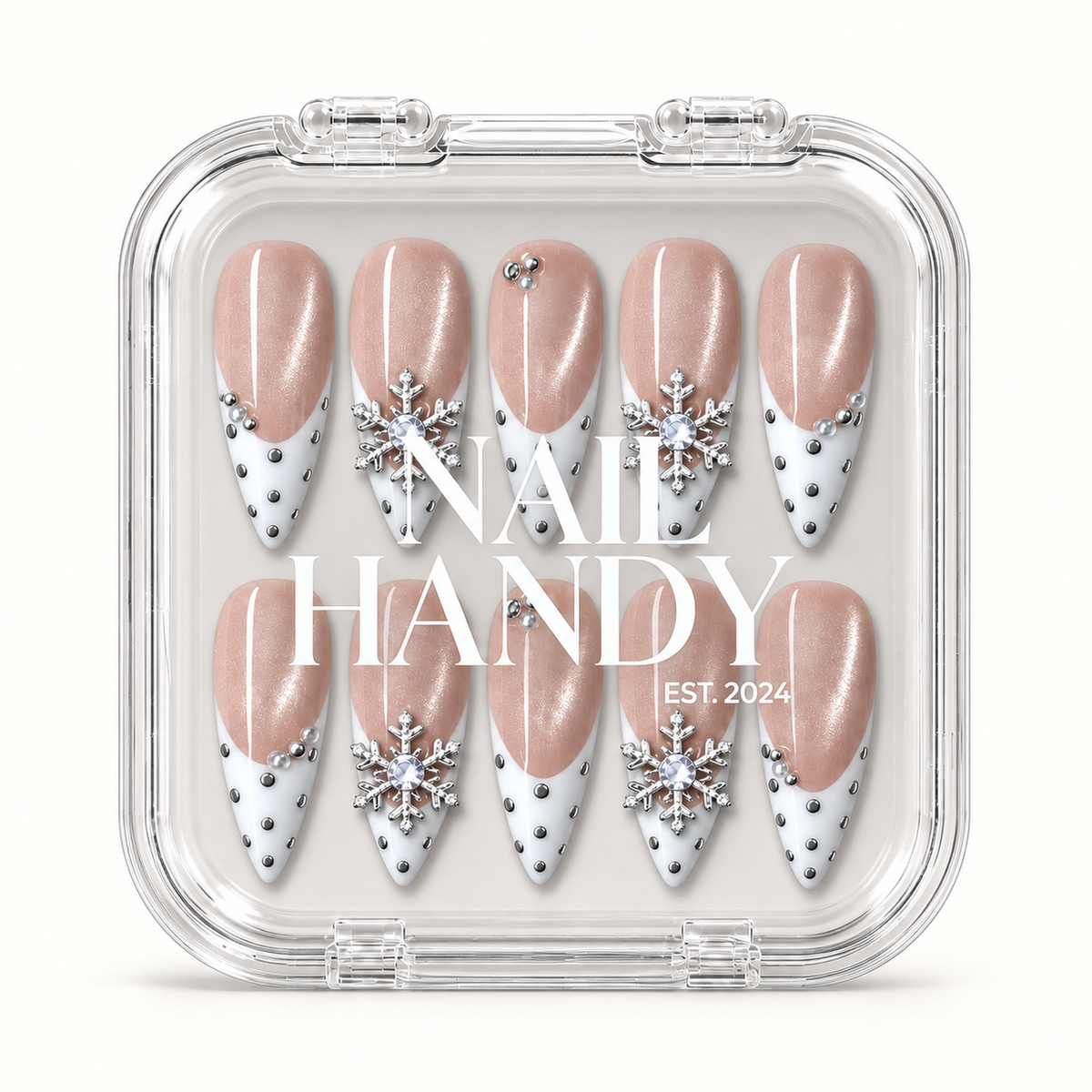 Clear Nail Handy display box showing ten Pearl Snowfall nails in two rows, with blush shimmer, white tips, and silver snowflake accents.