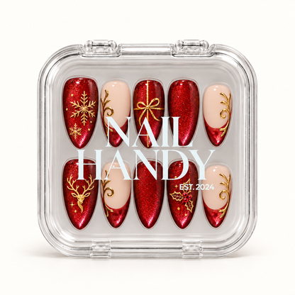 Closed clear Nail Handy case displaying ten ruby-red and blush Christmas nails, with white branding across the lid.