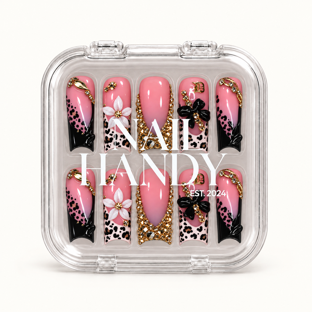 Closed clear Nail Handy case displaying ten pink leopard and floral nails in two rows, with white branding across the lid.