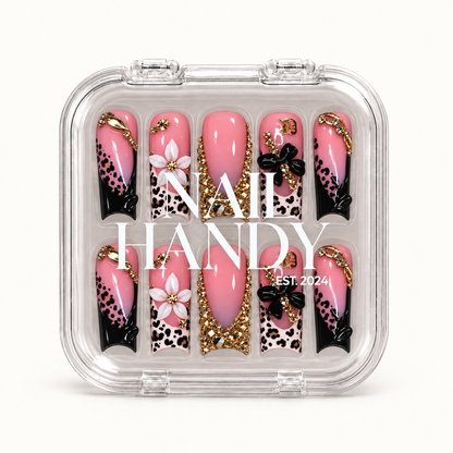 Closed clear Nail Handy case displaying ten pink leopard and floral nails in two rows, with white branding across the lid.